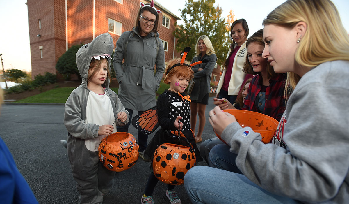 Students handing out candy